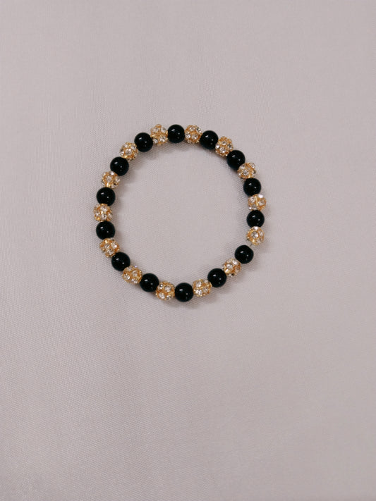 Black and golden bead bracelet